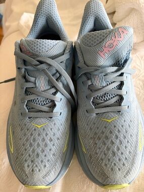 Hoka Clifton 9 Light Blue Running Sneakers with Pink Logo and Yellow Accents